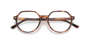Close front view of havana striped prescription eyeglass frames with lens detailing