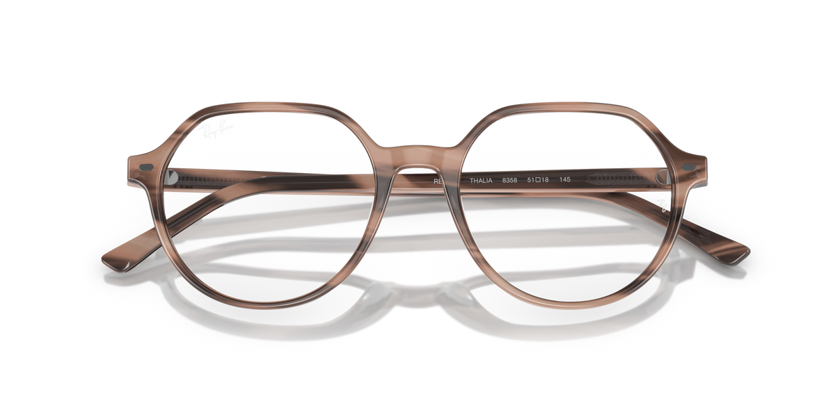Havana-tone prescription eyewear frames with round lenses and slim metal bar front
