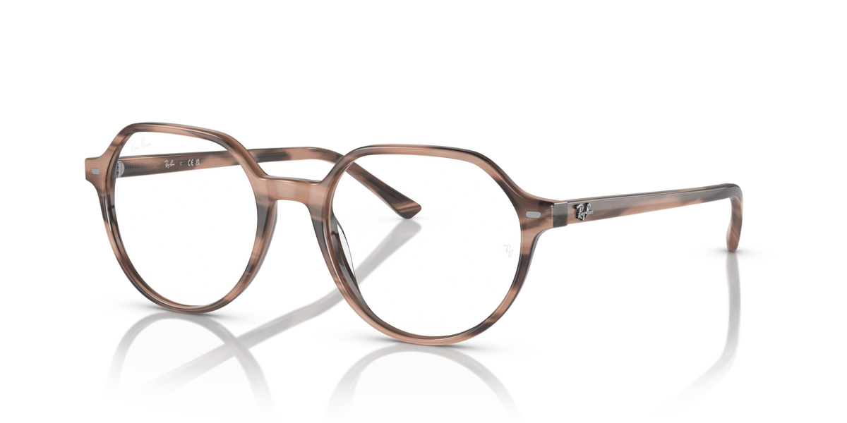 Havana-tone prescription eyewear frames with round lenses and thin metal temples