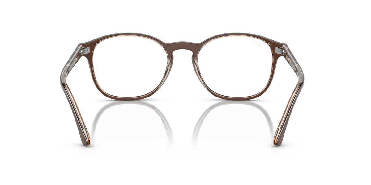 Prescription eyewear frames, brown translucent rounded rectangular with white lenses