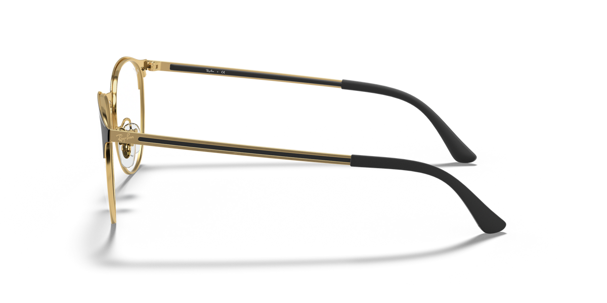 Metal prescription eyewear frames, side view with gold-toned temples and round lens rim