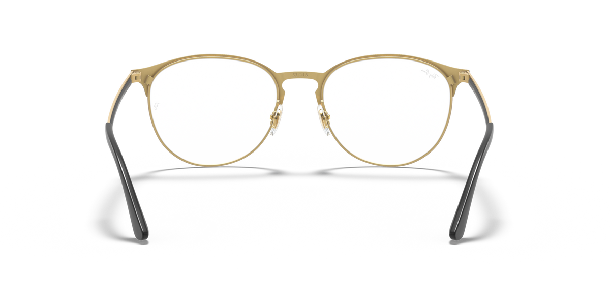 Gold-tone round eyeglass frames with dark bridge and curved temples