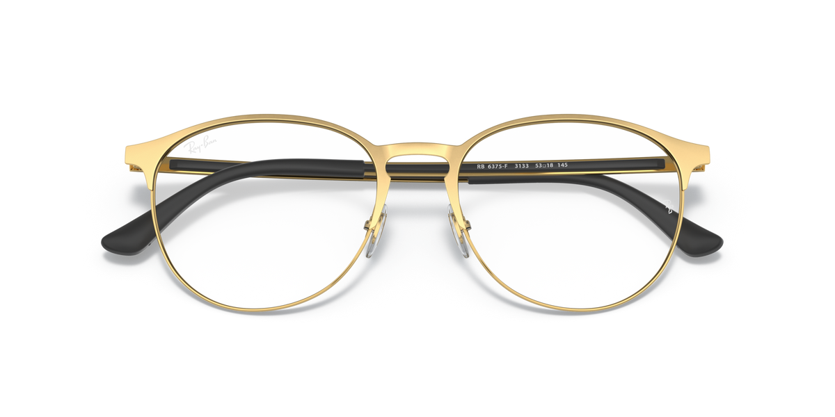 Gold-tone round eyeglass frames with dark top bar and black temple accents