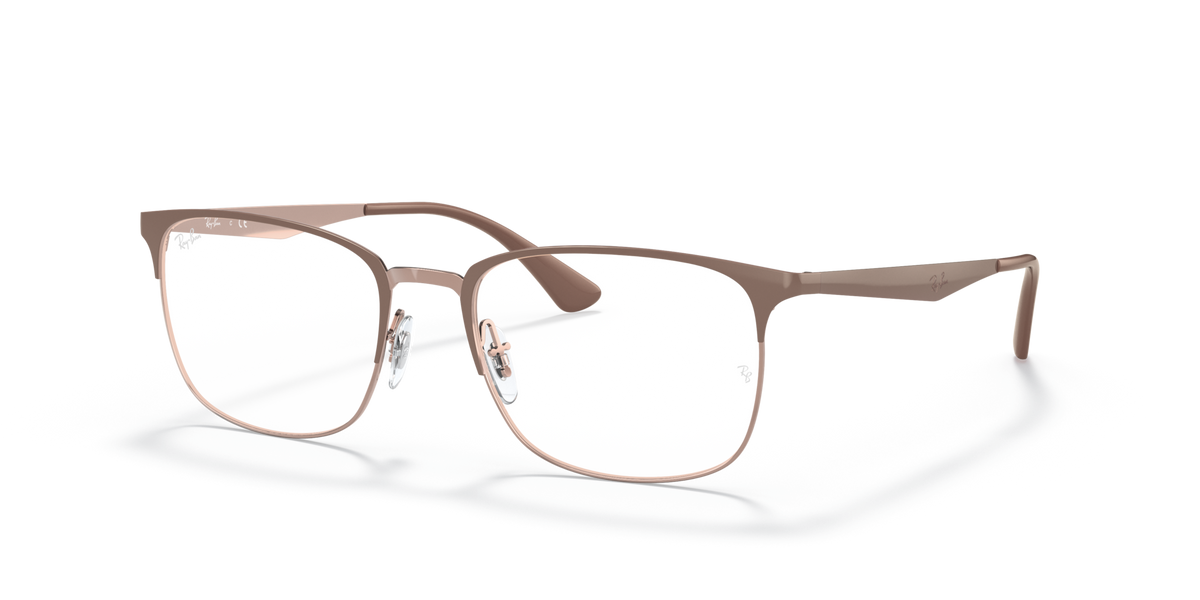 Prescription eyewear frames in beige with copper-toned metal temples, angled view