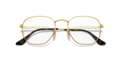 Gold-tone hexagonal prescription eyewear frames with black temple tips, front view