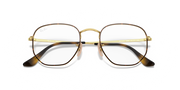 Hexagonal prescription eyewear frames, gold full-rim with dark temple tips