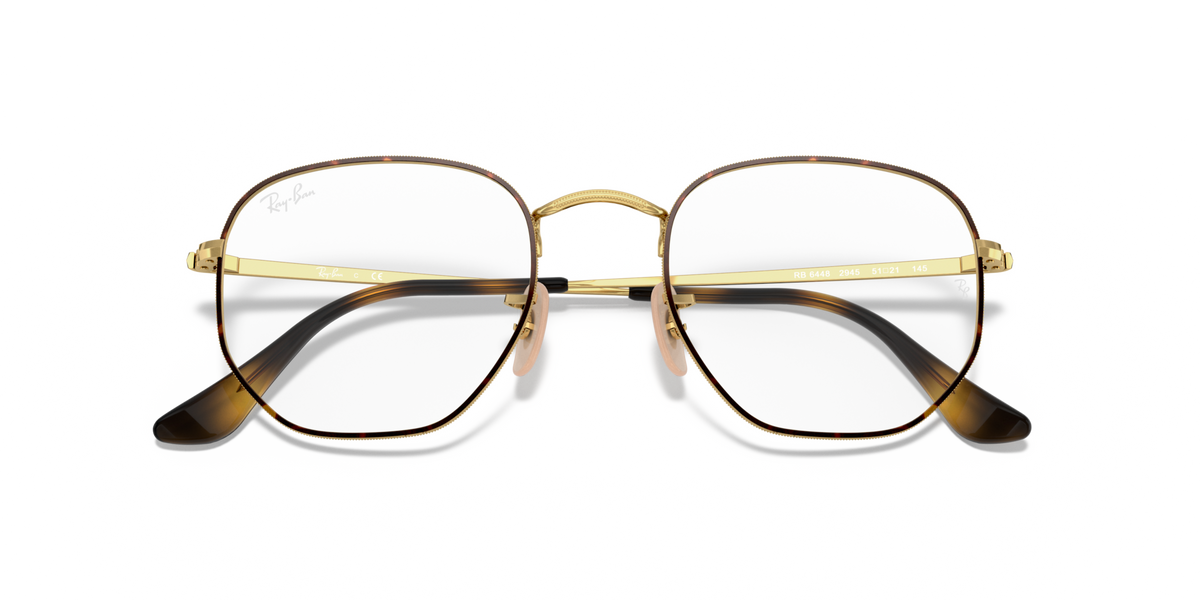 Hexagonal prescription eyewear frames, gold full-rim with dark temple tips