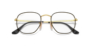 Gold-tone hexagonal prescription eyewear frames with black temple tips, front view
