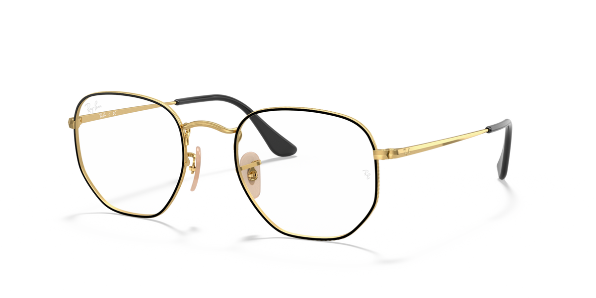 Gold-tone hexagonal prescription eyewear frames with black temple tips, front view