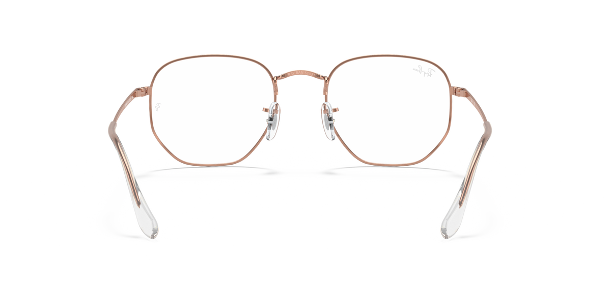 Rose gold hexagonal eyeglass frames with clear lenses and metal temples