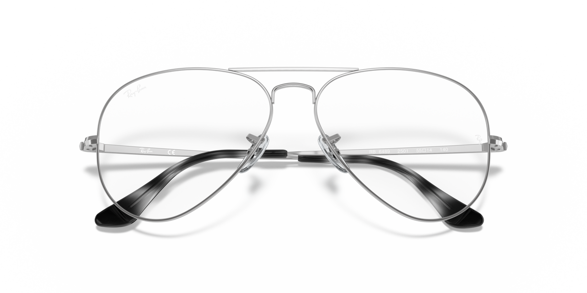 Silver aviator prescription eyewear frames with clear lenses and black temple details