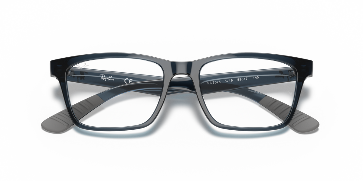 Ray-Ban prescription eyewear frames in transparent grey-blue, front view with temple details