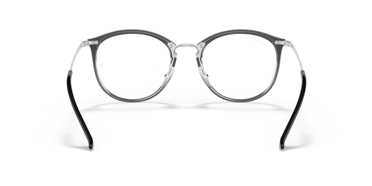 Ray-Ban dark prescription eyewear frames, round lenses with arched metal bridge