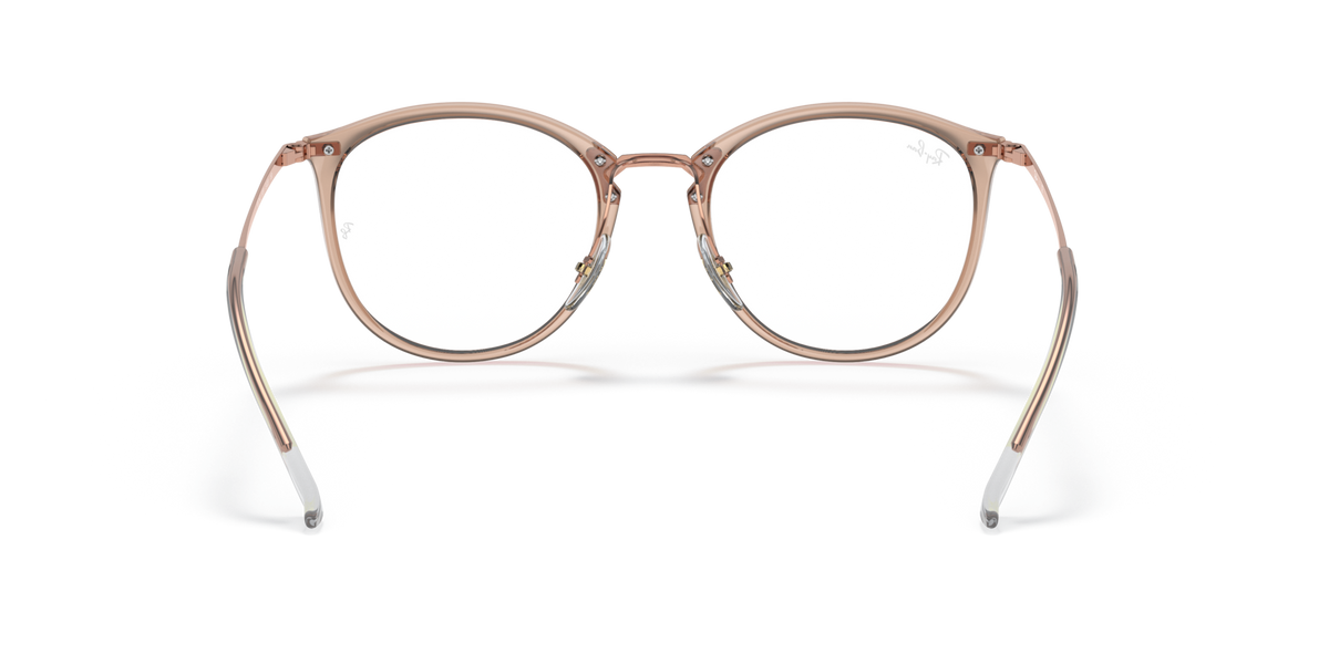 Prescription eyewear frames, transparent light brown with rose-gold metal, angled front view