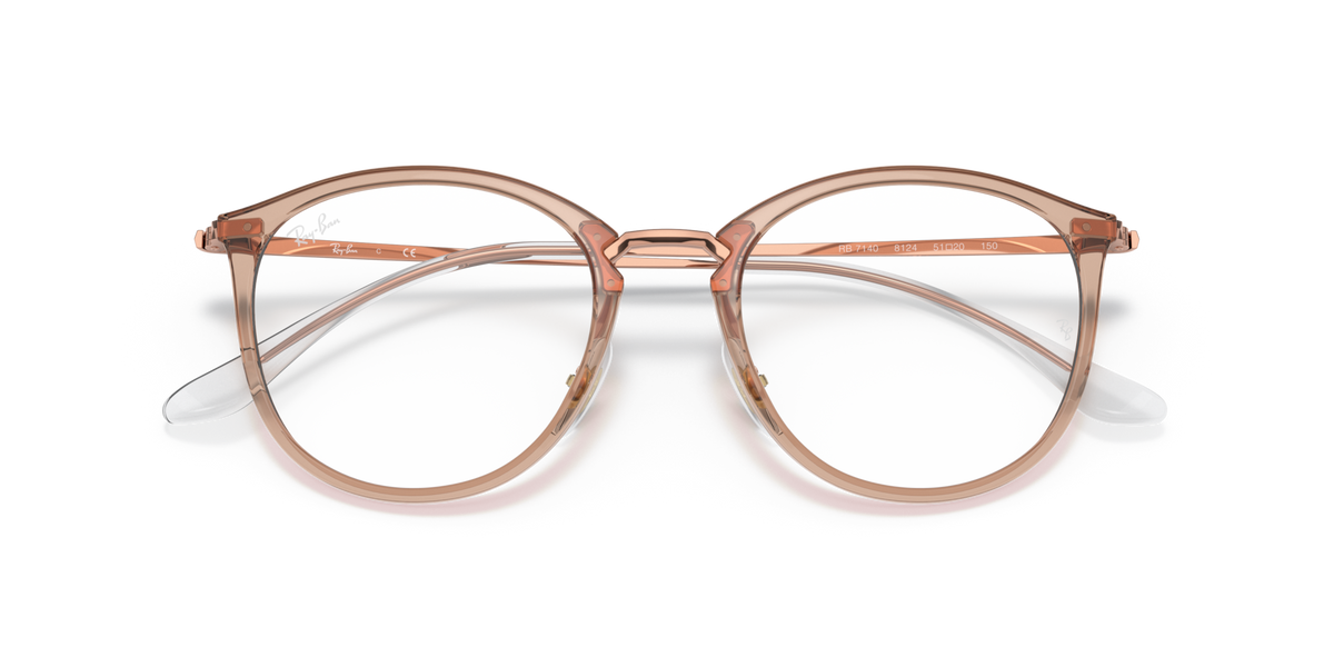 Prescription eyewear frames, transparent light brown with metal accents, front view
