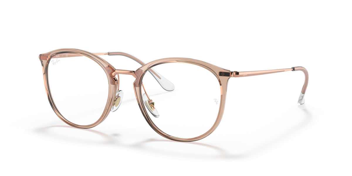 Prescription eyewear frames, transparent light brown with rose-gold metal, front view
