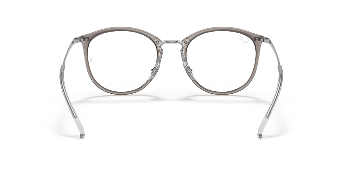 Prescription eyewear frames, transparent grey with dark metal, angled front view