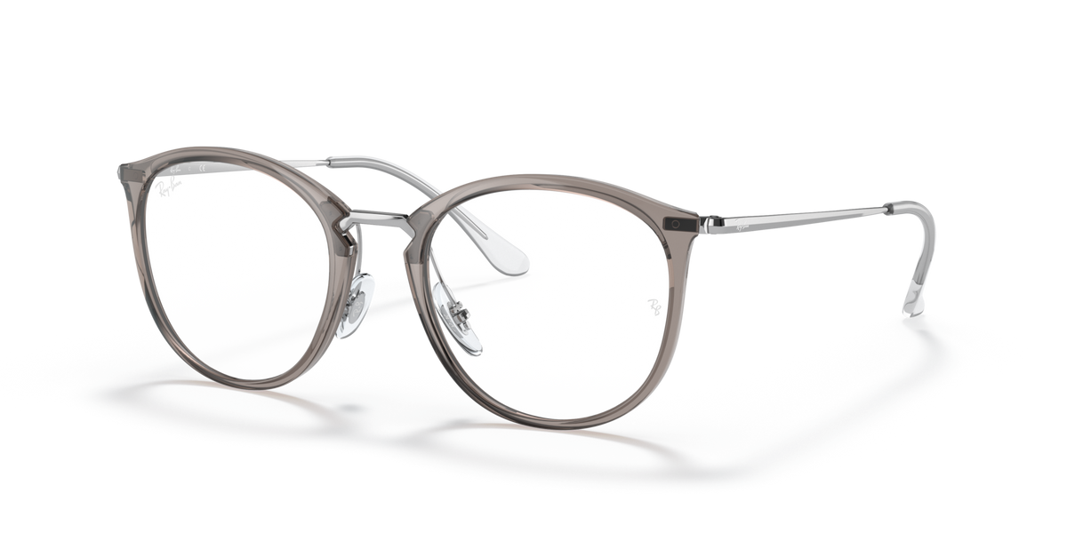 Prescription eyewear frames, transparent grey with dark metal, side profile