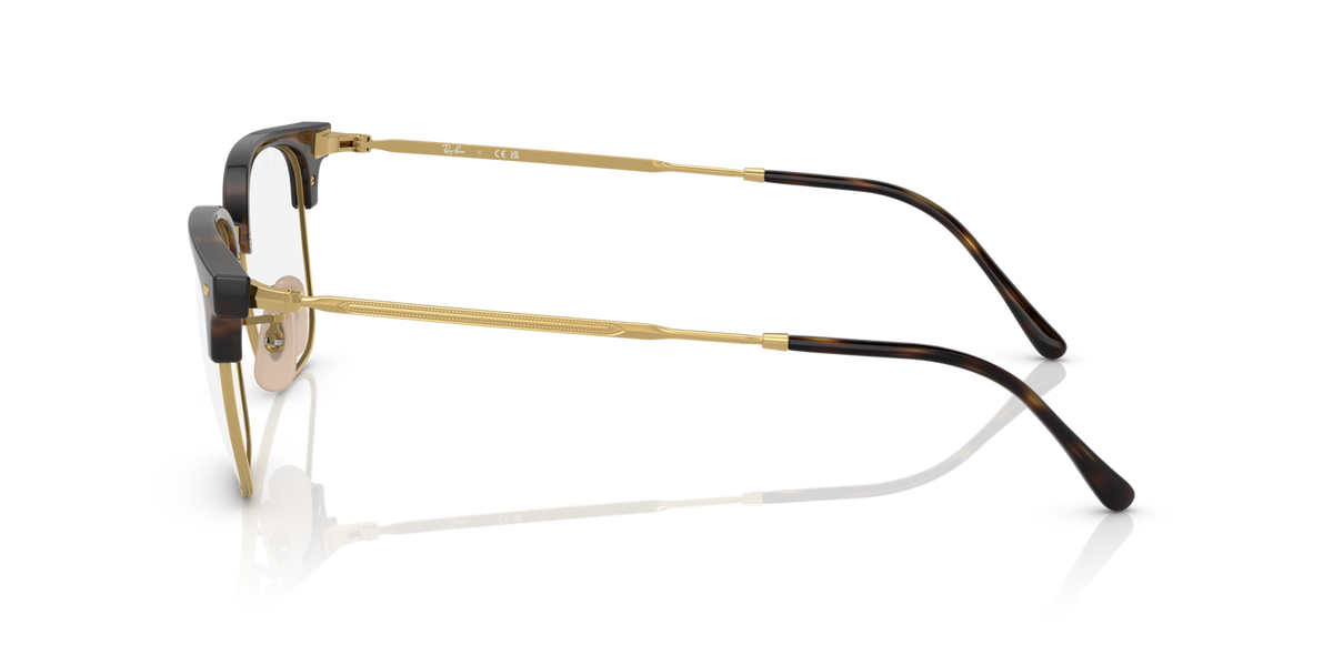 Brown tortoise eyeglass frames with clear lenses, side profile view