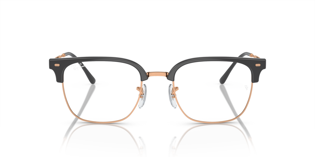 Ray-Ban prescription eyeglass frames, dark frame with copper-toned accents and clear lenses