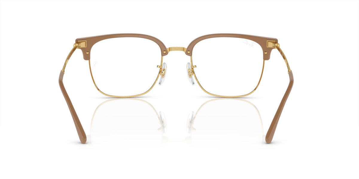 Rectangular eyeglass frames in brown tortoise with gold metal details