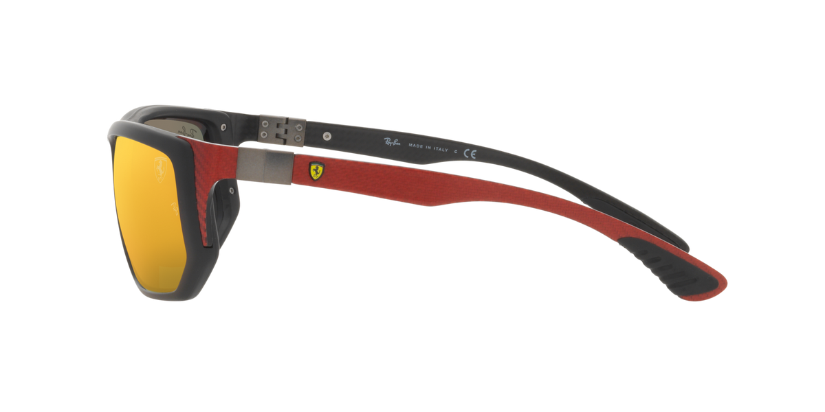 Sunglasses angled view with dark frame and yellow mirrored lenses; red temples