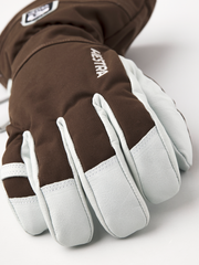 Brown ski gloves with light gray palm panels and padded finger sections