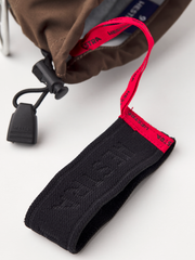 Black wrist strap with red lanyard and Hestra webbing label