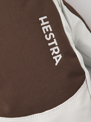 Close-up of Hestra ski mitten leather palm in dark brown with white piping