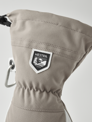Light tan ski glove with HESTRA shield patch and metal carabiner loop