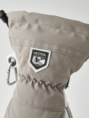 Beige ski mitten cuff with HESTRA logo patch and metal carabiner ring