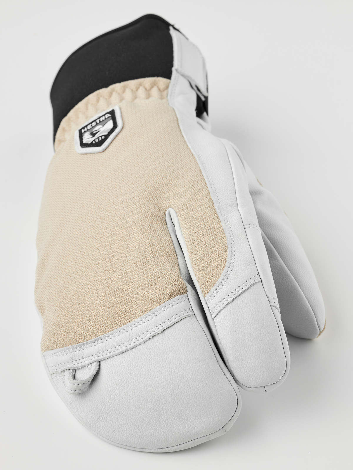 3-finger leather glove with tan knit palm panel and white leather outer
