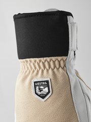 Leather and textile patrol gloves with black upper and beige cuff, Hestra patch.