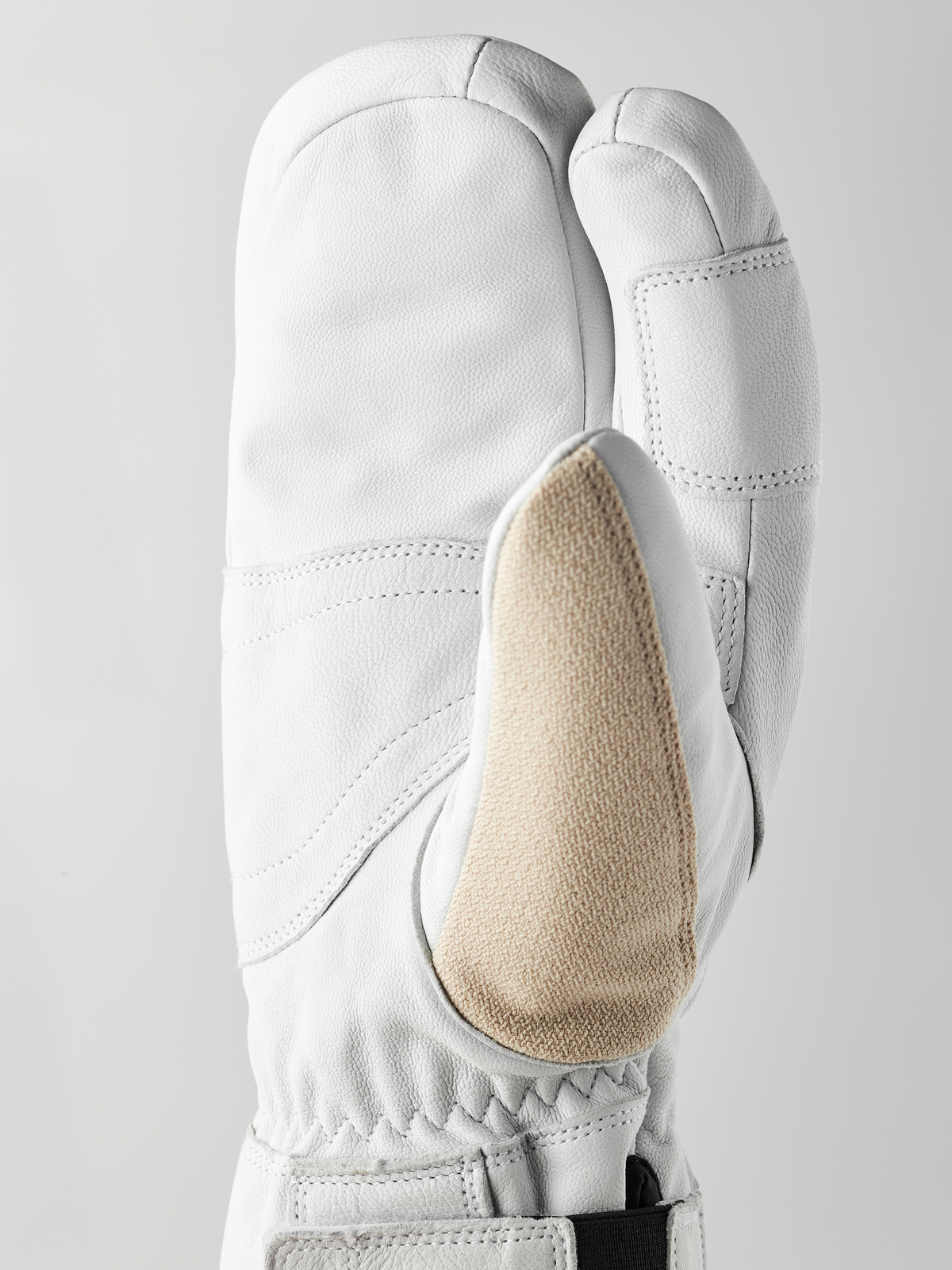Three-finger leather patrol gloves with white shell and beige palm insert, cuff seam detail