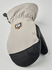 Beige and black mountain mittens with HESTRA patch and wrist strap