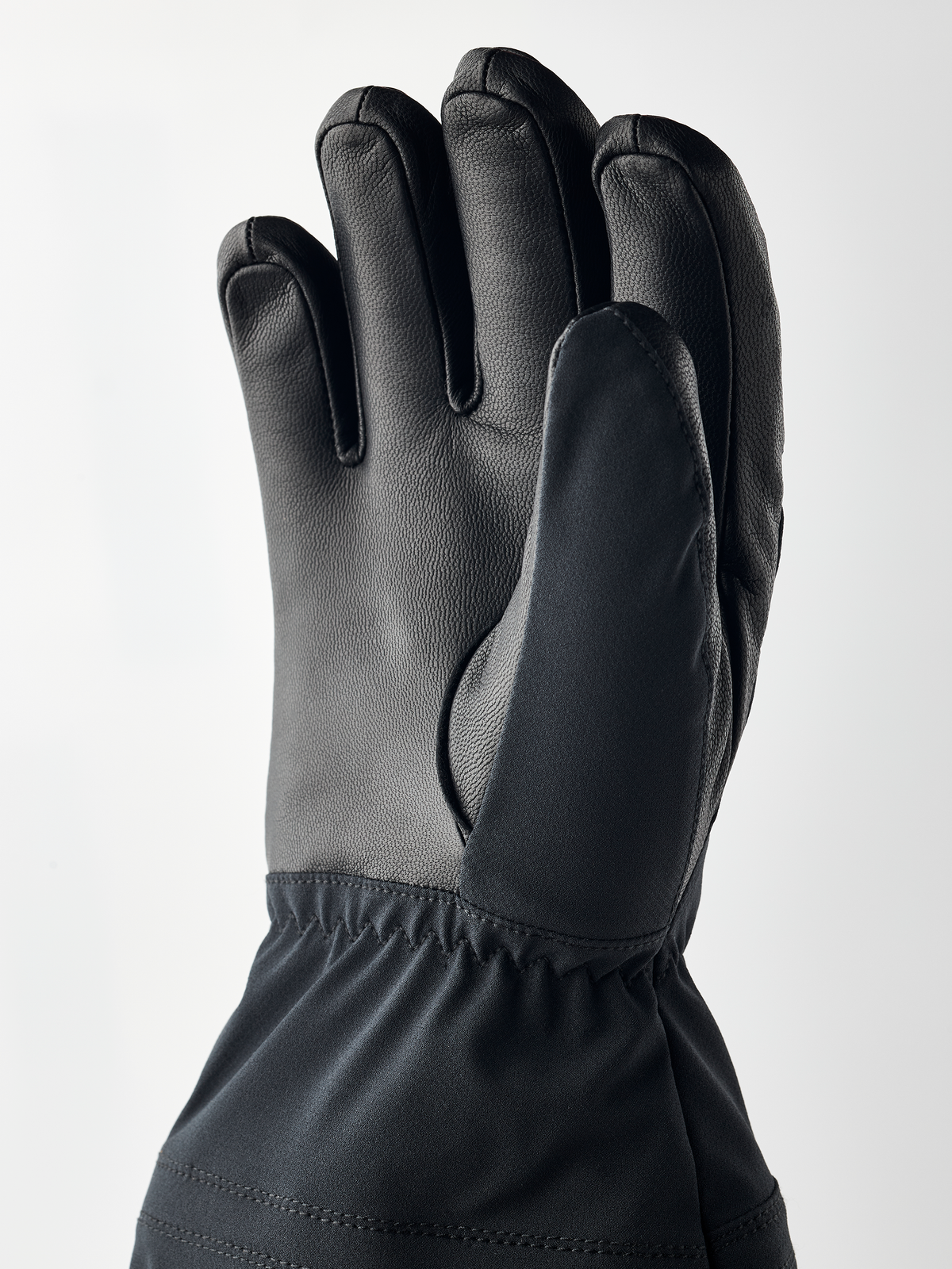 Black junior gloves with quilted cuff and five-finger leather design