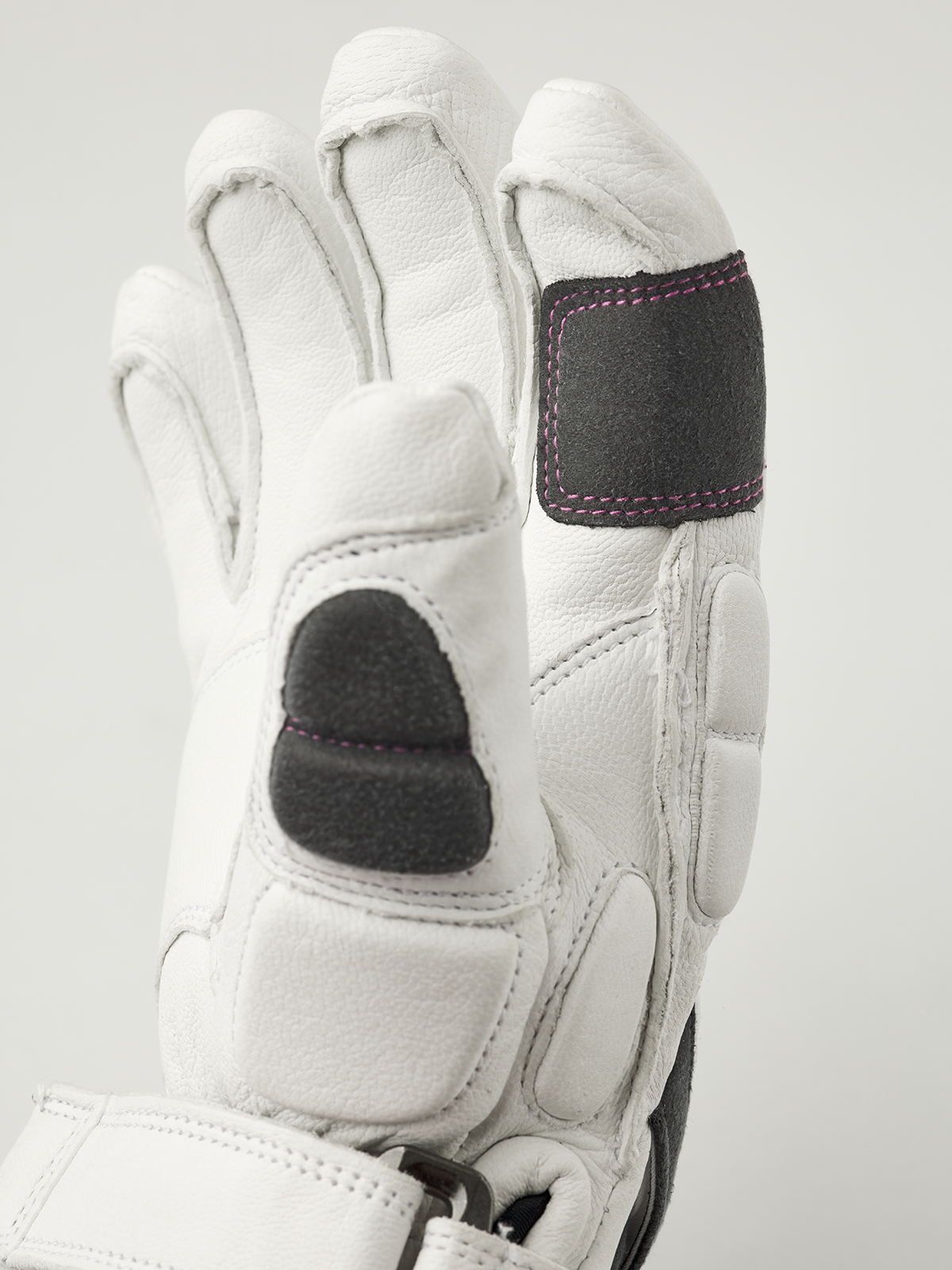 Kids racing gloves, white leather with black palm and knuckle patches, pink trim