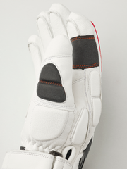 Hestra Impact Racing SR white glove close-up, padded thumb and orange seam details