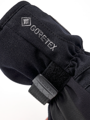 Black junior GORE-TEX mitt with 'GORE-TEX' print and hook-and-loop strap