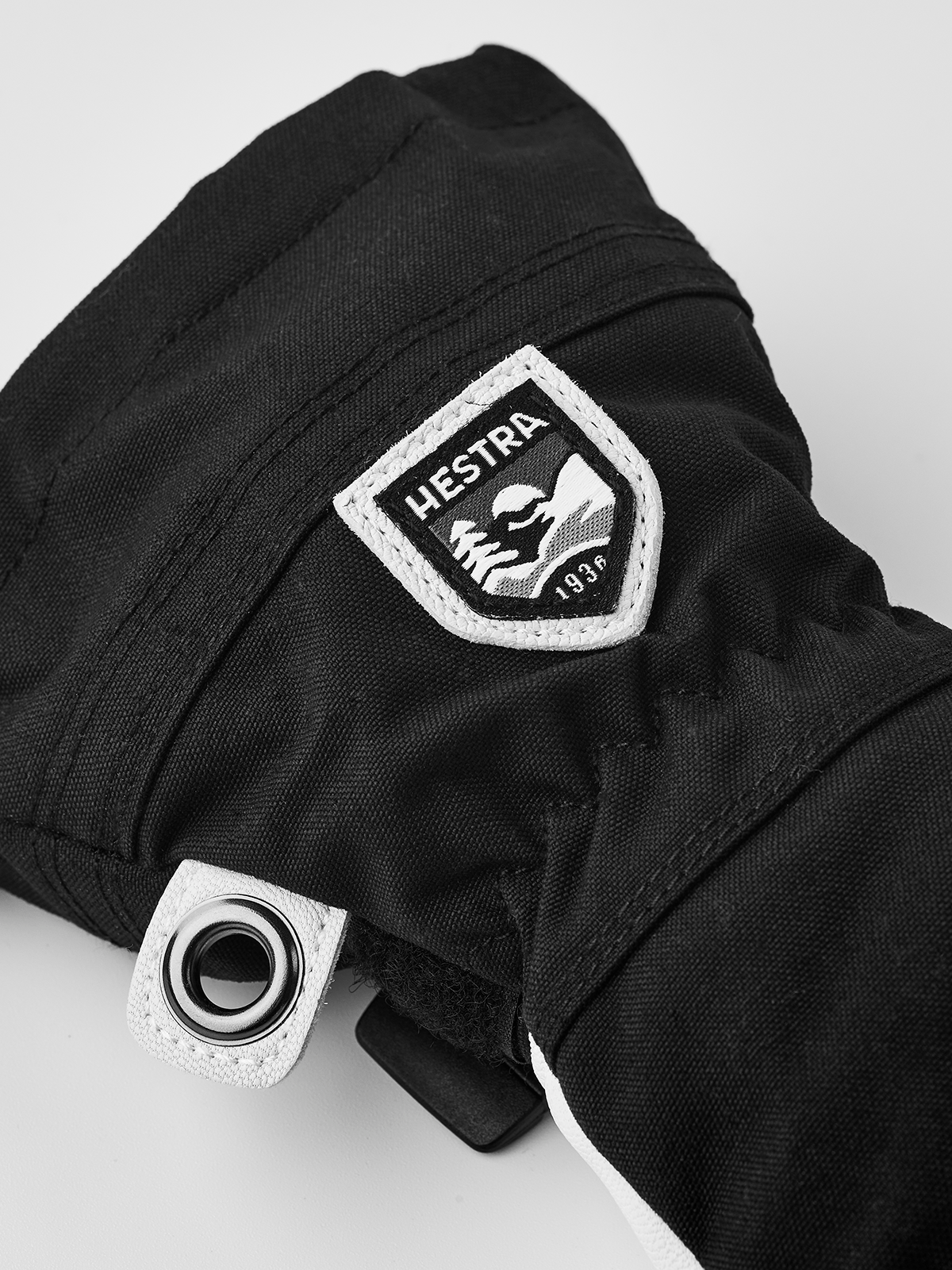 Kids black leather ski gloves with wrist strap and Hestra patch badge