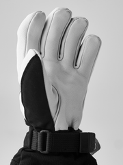 Hestra junior ski gloves with white leather back and black palm, plus wrist strap