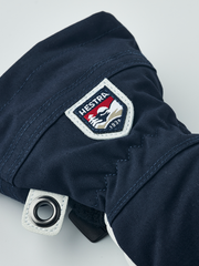 Hestra junior ski gloves in navy with Hestra logo patch and metal eyelet