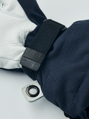 Kids navy ski gloves with dark wrist strap and Hestra logo clip detail