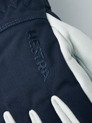 Navy ski junior glove with white leather palm and embroidered HESTRA logo