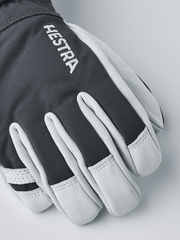 Kids dark grey and light grey ski gloves with Hestra lettering on back