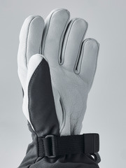 Hestra junior ski gloves in light gray with black palm panel and dark wrist strap