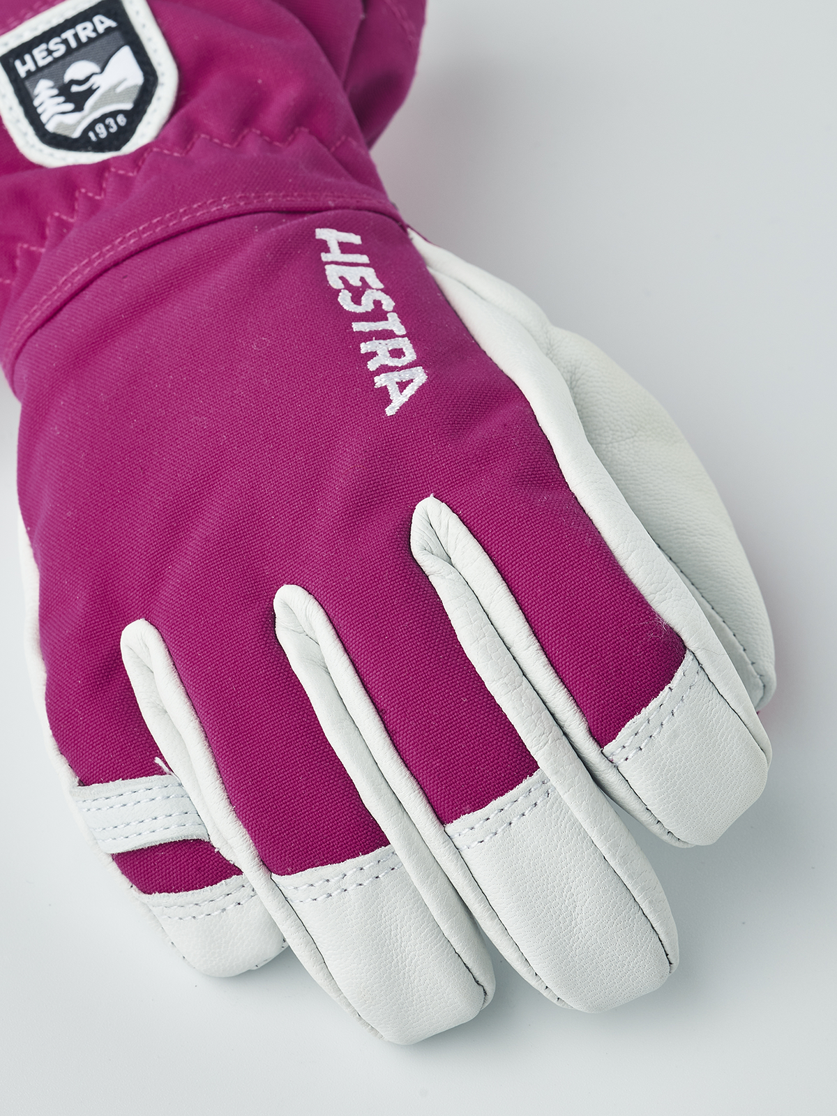 Fuchsia ski junior glove with white palm panels and HESTRA logo embroidery