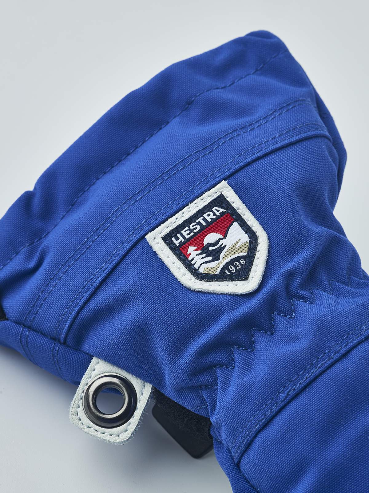 Hestra junior ski glove in royal blue with Hestra patch and stitched wrist rivet