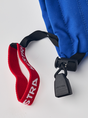 Junior ski mitten with blue shell, red HESTRA strap, and black adjuster clip