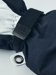 Navy blue junior ski gloves with white leather trim, black wrist strap, and loop